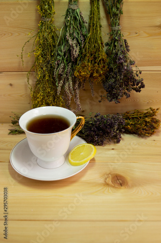 Medicinal herb, an hour with lemon flu prevention. Warm wooden background. The concept of health. Autumn. Winter