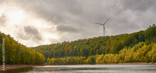 Windmills above lake 