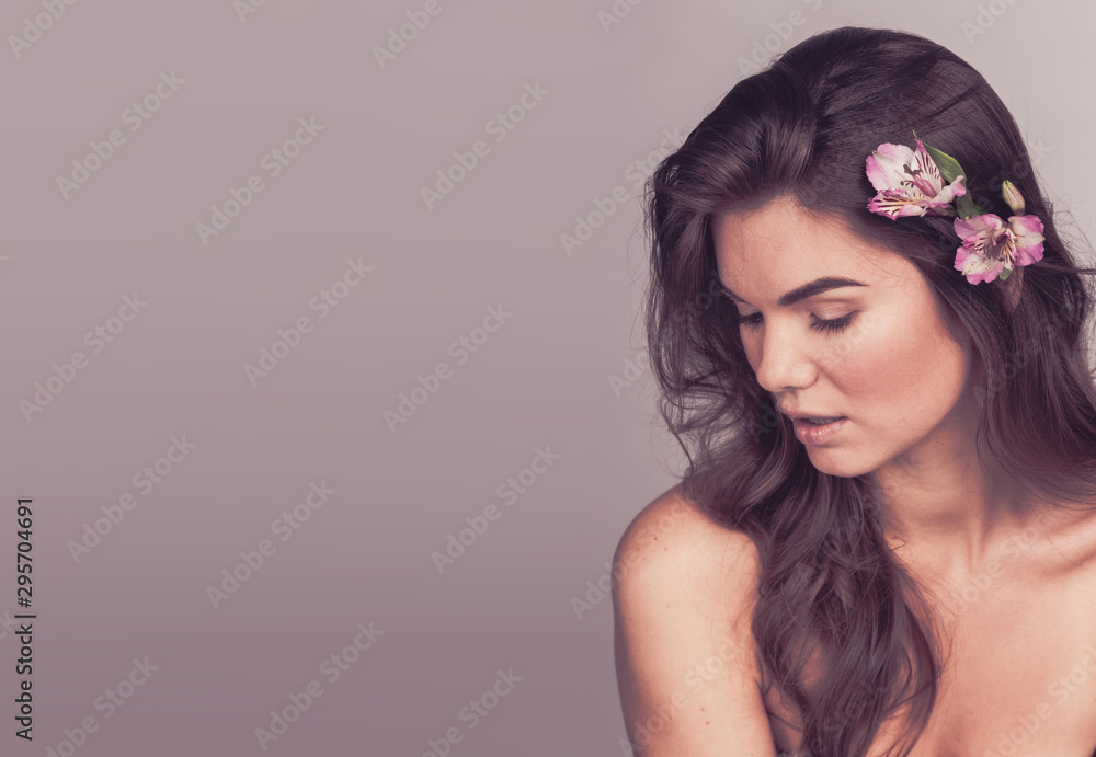 Beautiful woman with flower in hair Beautiful woman with flower in hair