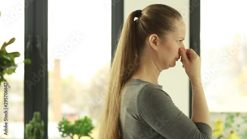 Woman reacts to stink. Bad smell. Stench. Mud.