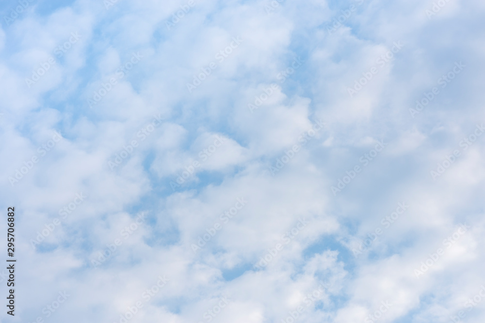 landscape sky with blue clouds and sunbeams at sunset. Background texture landscape sky with blue clouds and sunbeams at sunset. Background texture