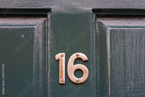 Sweet 16 on a green front door