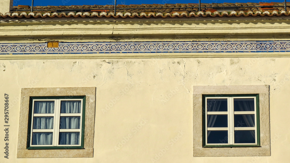 Closeup of a Typical facade of a building with tiles (azuleios) wall of Lisbon, Portugal Closeup of a Typical facade of a building with tiles (azuleios) wall of Lisbon, Portugal