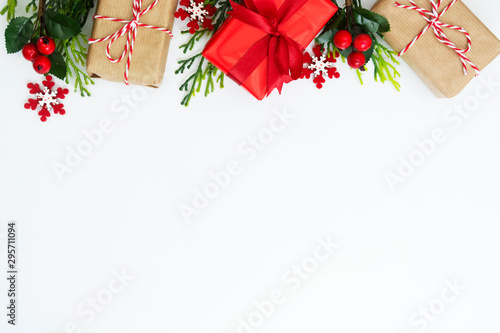 Christmas background, mock up with gift boxes wraped in craft paper, on white background. Winter holidays. Top view with copy space.