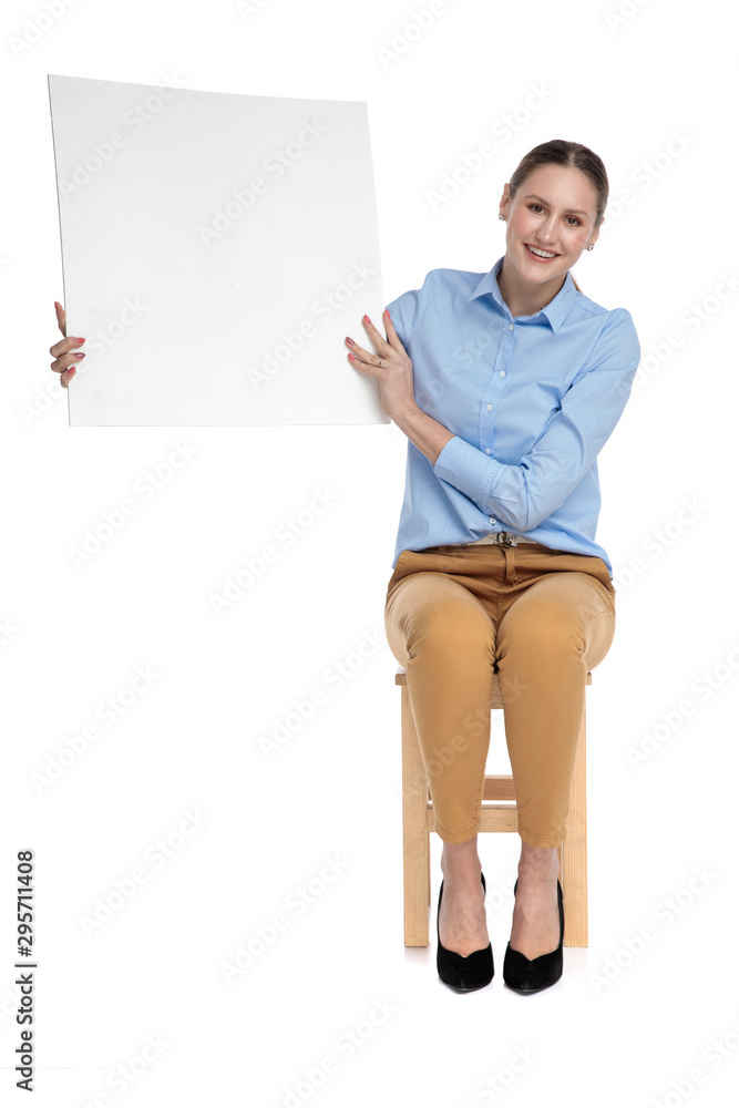 smiling businesswoman showing empty board smiling businesswoman showing empty board
