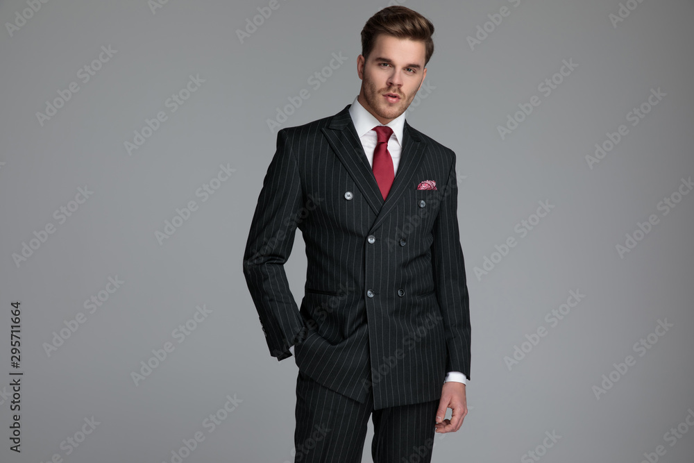 young fashion model wearing double breasted suit young fashion model wearing double breasted suit