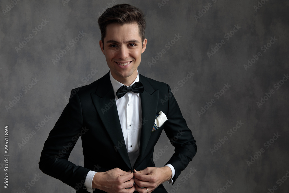 happy elegant man wearing tuxedo and smiling happy elegant man wearing tuxedo and smiling