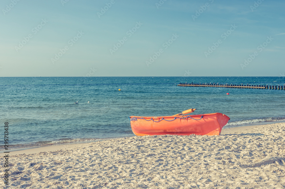 Baltic sea coast, lifeguard boat on sandy beach, Rowy Poland Baltic sea coast, lifeguard boat on sandy beach, Rowy Poland
