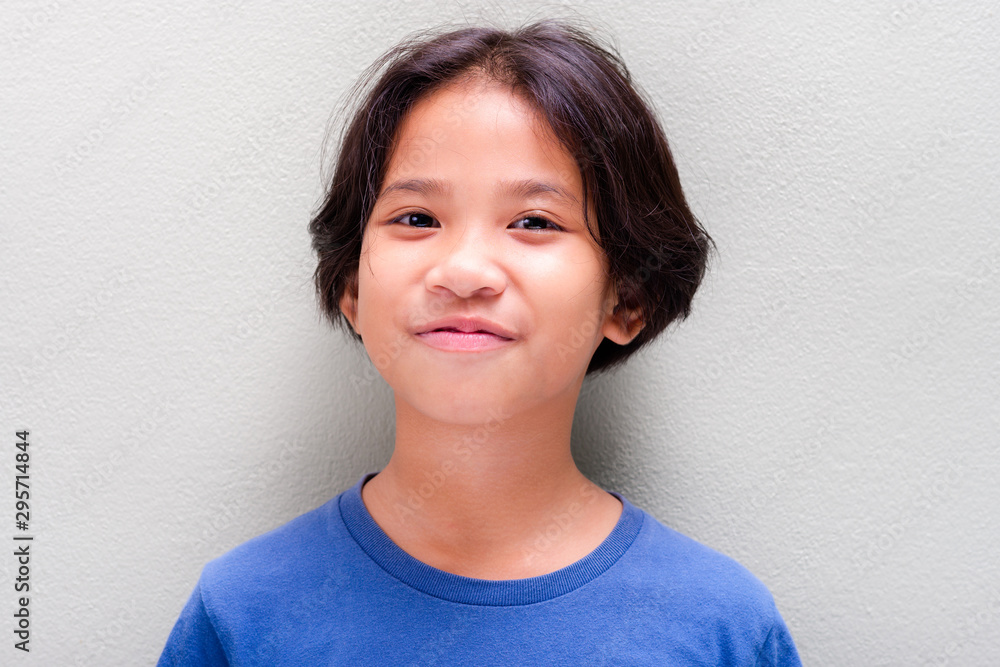 Pretty Thai Girl Smiling on Green Wall Pretty Thai Girl Smiling on Green Wall