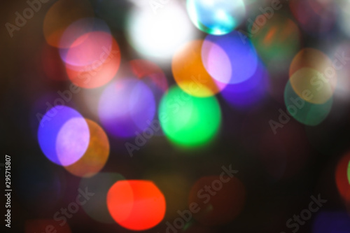 Beautiful Christmas background with garlands and bokeh. New year multi-colored picture. Abstract photo image for design
