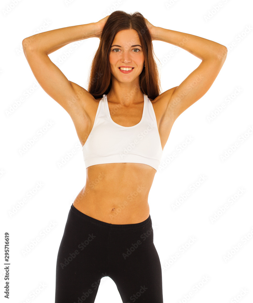 Fitness model with a flat stomach isolated on a white background Fitness model with a flat stomach isolated on a white background