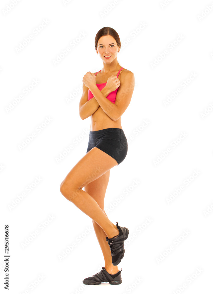 Young fitness brunette woman in red top and black shorts Young fitness brunette woman in red top and black shorts