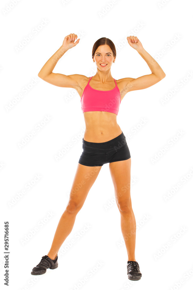 Young fitness brunette woman in red top and black shorts Young fitness brunette woman in red top and black shorts