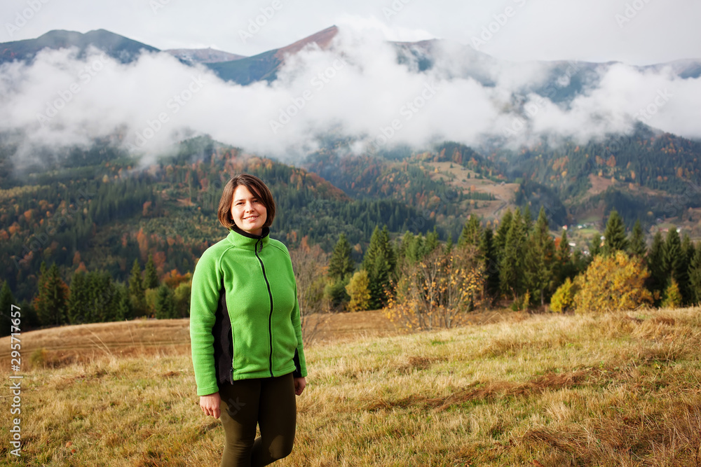 Hiker woman in moumtains in autumn