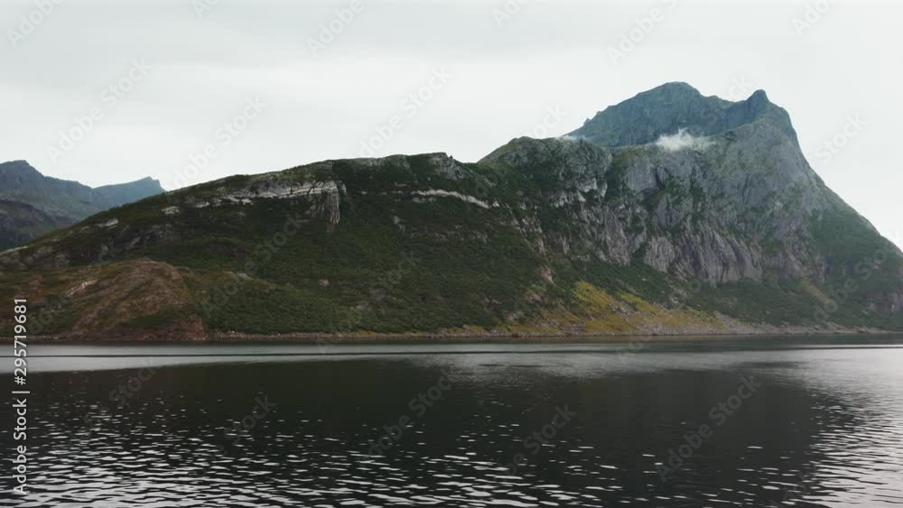 Mountains and sea landscape in Norway Traveling by ferry scenic view summer vacations moody nature Mountains and sea landscape in Norway Traveling by ferry scenic view summer vacations moody nature
