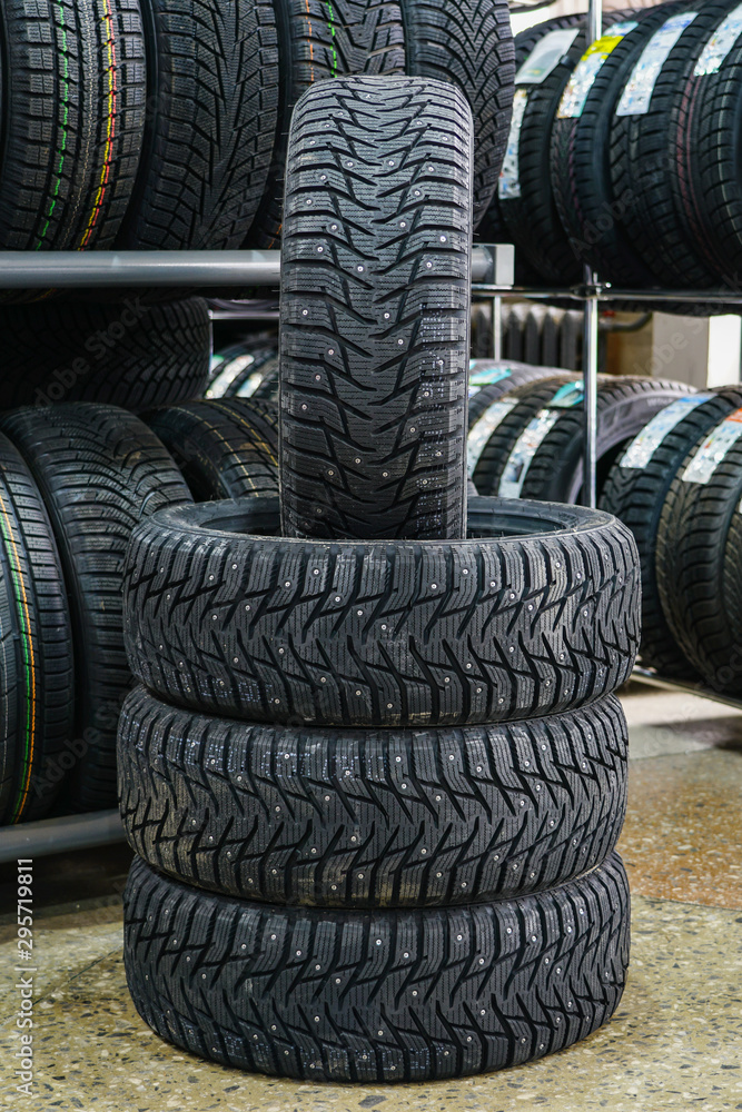 new winter tire set with studs at tire shop new winter tire set with studs at tire shop
