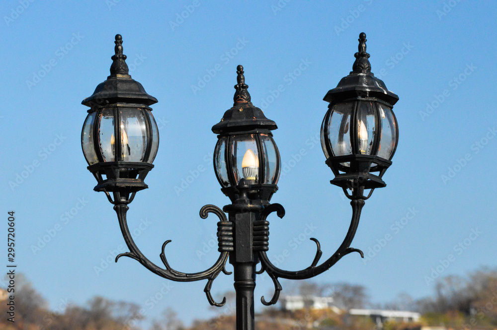 Triple lantern with sky background