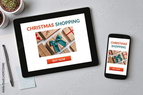 Christmas shopping concept on tablet and smartphone screen