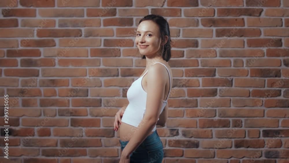 Transformation of pregnant woman's body during pregnancy. Jump cut