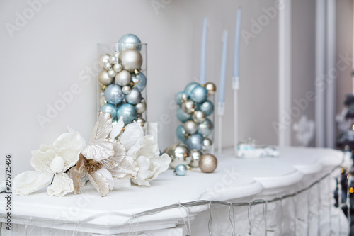 New Year's toys stand on the fireplace as decorations. Beautiful christmas background