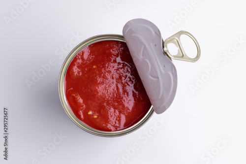Tin of chopped canned tomatoes, isolated on white background, soft light