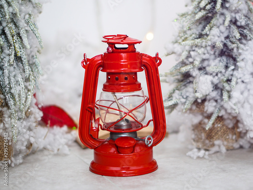Beautiful red lantern winter composition in white snow. Christmas and New Year theme. Background for design.
