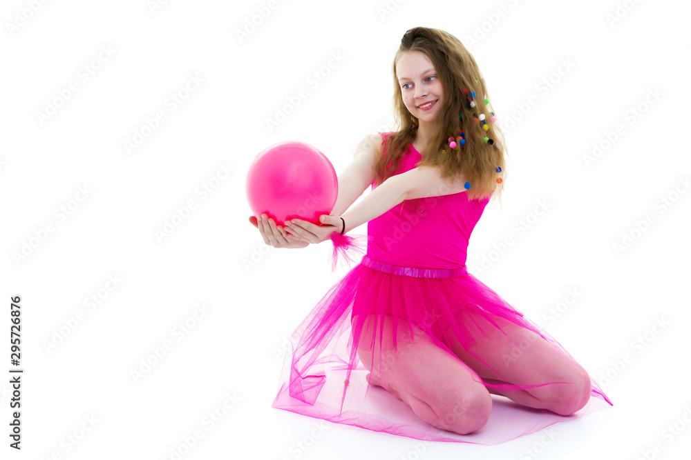 Girl gymnast performs exercises with the ball. Girl gymnast performs exercises with the ball.