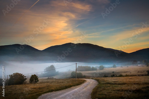 Sunrise on mountain with colorful skyline and fog Near the Drvar in Bosnia and Herzegovina