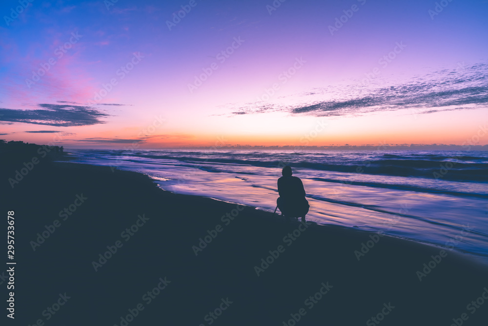 sunrise silhouette of man on beach sunrise silhouette of man on beach