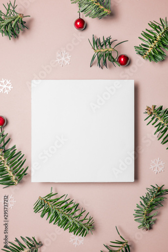  Blank card with fir tree branches red berries and star on pink background