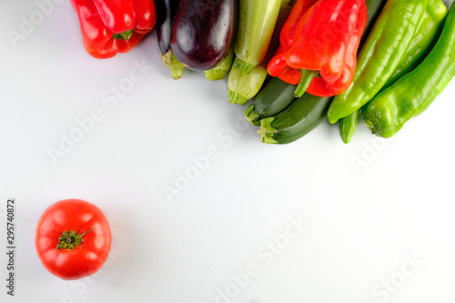 zucchinis , peppers red and green, eggplants, and tomato isolated