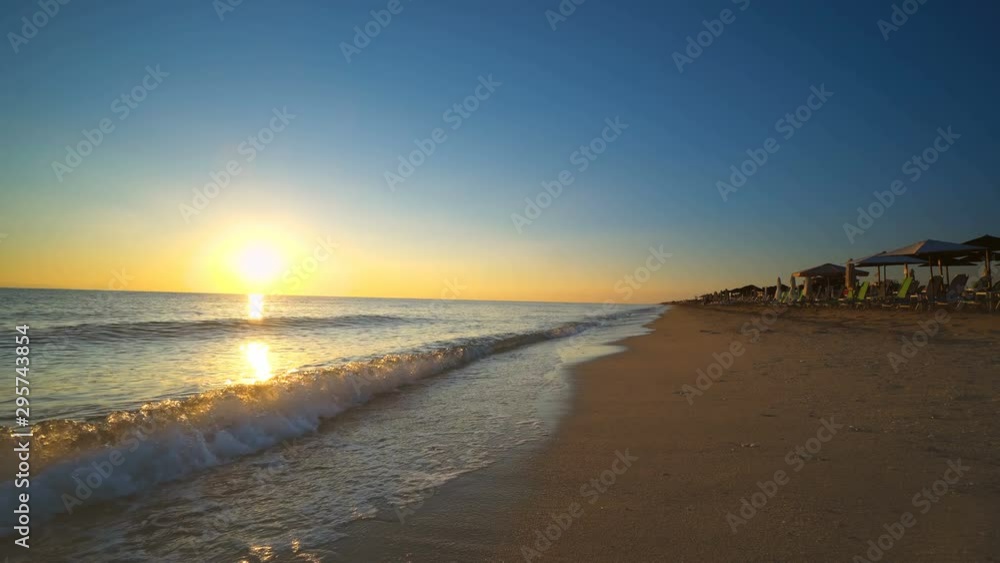Surf Waves Splashing the summer beach at sunset, sunrise, background loop Surf Waves Splashing the summer beach at sunset, sunrise, background loop