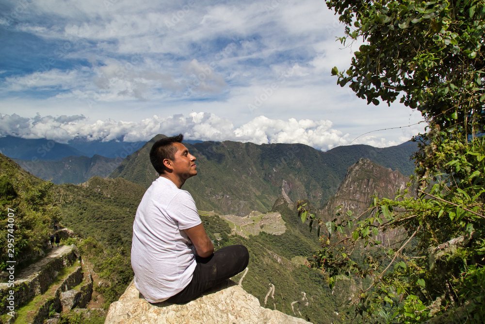 Traveller at the Lost city of the Incas, Machu Picchu,Peru on top of the mountain, with the view panoramic Traveller at the Lost city of the Incas, Machu Picchu,Peru on top of the mountain, with the view panoramic
