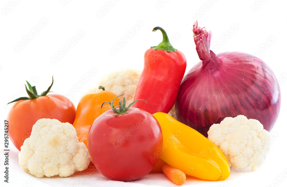 Vegetable Mix for salad on white background. Salad Ingredients with tomatoe, cauliflower, carrots, onion and peppers. Health Concept Vegetable Mix for salad on white background. Salad Ingredients with tomatoe, cauliflower, carrots, onion and peppers. Health Concept