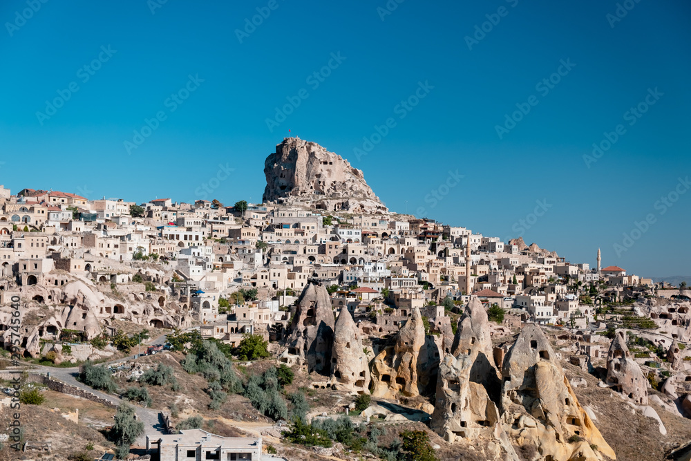 Cityscape photo of Uchisar Town, Cappadocia, sky ise clean blue.