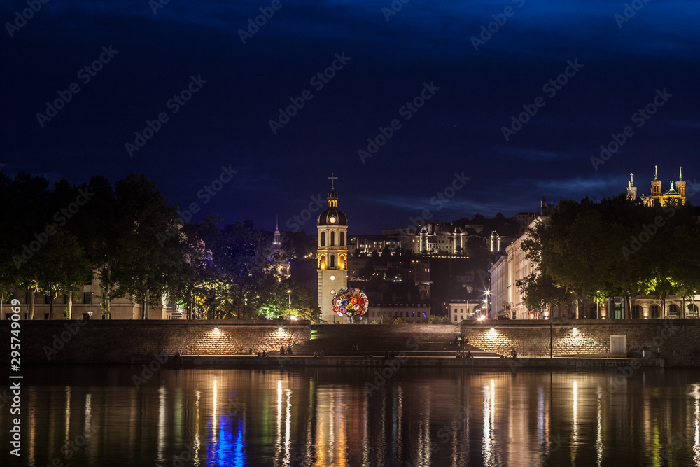 Panorama of Presqu'ile district in Lyon at Night with Basilique de Fourviere Church and Clocher de la Charite Clocktower. It is the remaining of a former hospital and a major landmark of Lyon, France