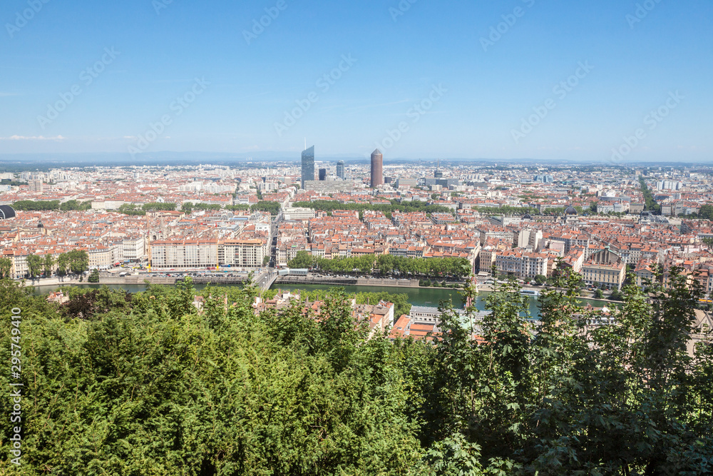 Aerial panoramic view of Lyon with the skyline of Lyon skyscrapers visible in background and Saone river in the foreground, with the narrow streets of Old Lyon district