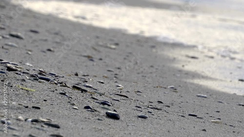 Wallpaper Mural pebble stones by the sea. Silky waves of blue sea. background Torontodigital.ca
