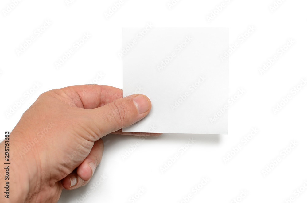 Man holds a white sheet of paper on a white background. Man holds a white sheet of paper on a white background.