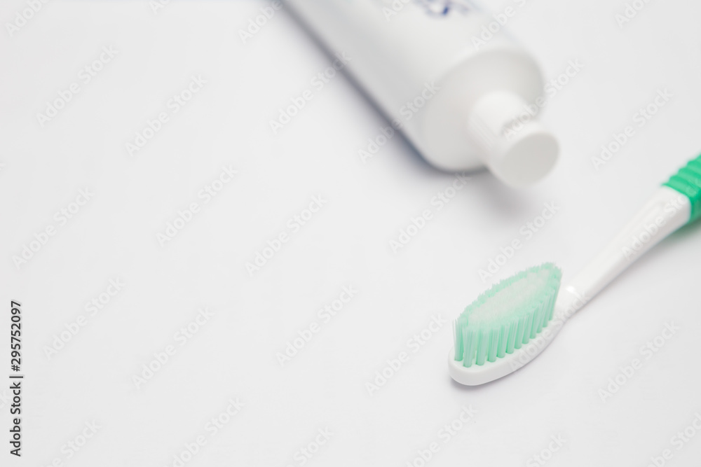 Toothbrush and toothpaste tube on a white background Toothbrush and toothpaste tube on a white background