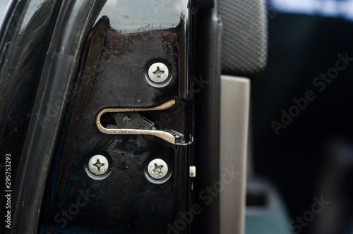 Door closing lock in a black modern car.