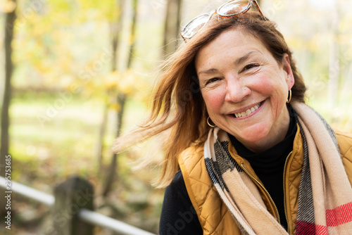 candid portrait of happy woman in autumn