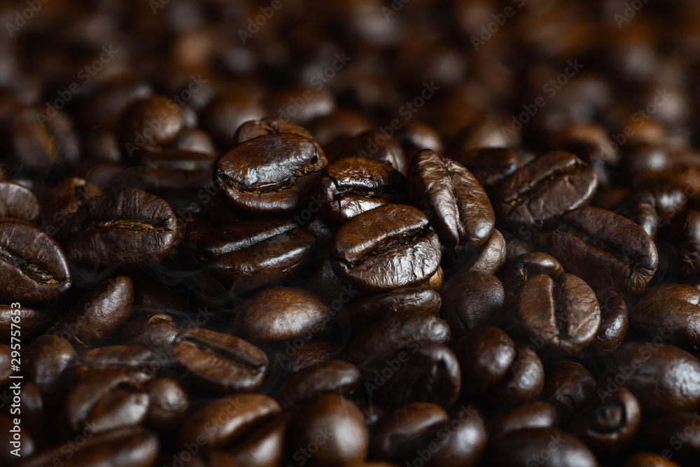 closeup background of arabica coffee beans closeup background of arabica coffee beans