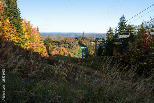 Ski mountain in autumn with view on the lake and golf, Canada