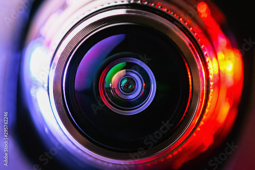 Close-up camera lens with purple and red backlight. Optics. Gorizontal photo