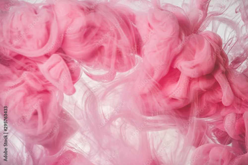 Fototapeta premium Pink color explosion. Colorful ink in water. Abstract background