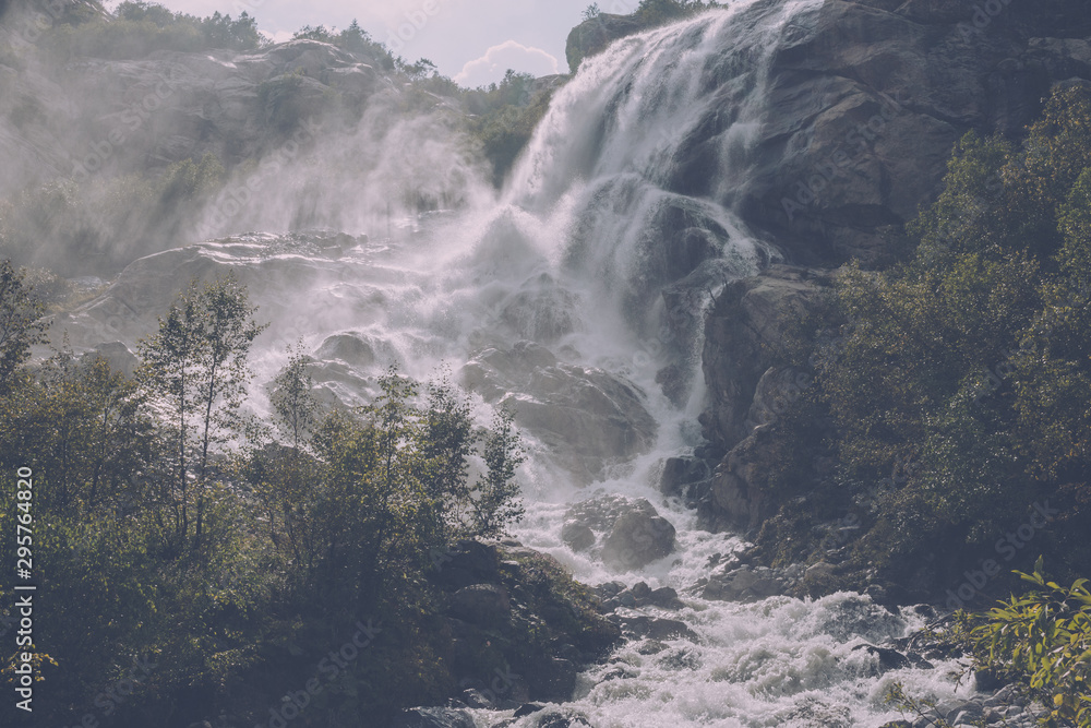 Panorama view of waterfall scene in mountains, national park of Dombay, Caucasus Panorama view of waterfall scene in mountains, national park of Dombay, Caucasus