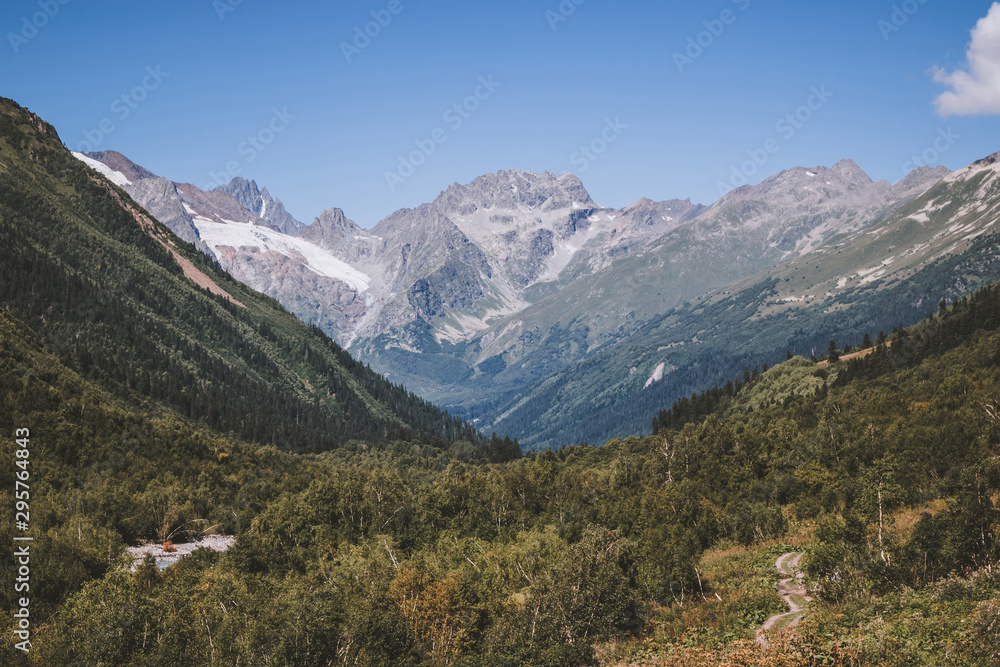 Fototapeta premium Close up view mountains and river scenes in national park Dombay, Caucasus