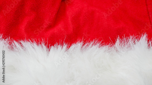 red and white fabric christmas background, red cloth and soft white fur