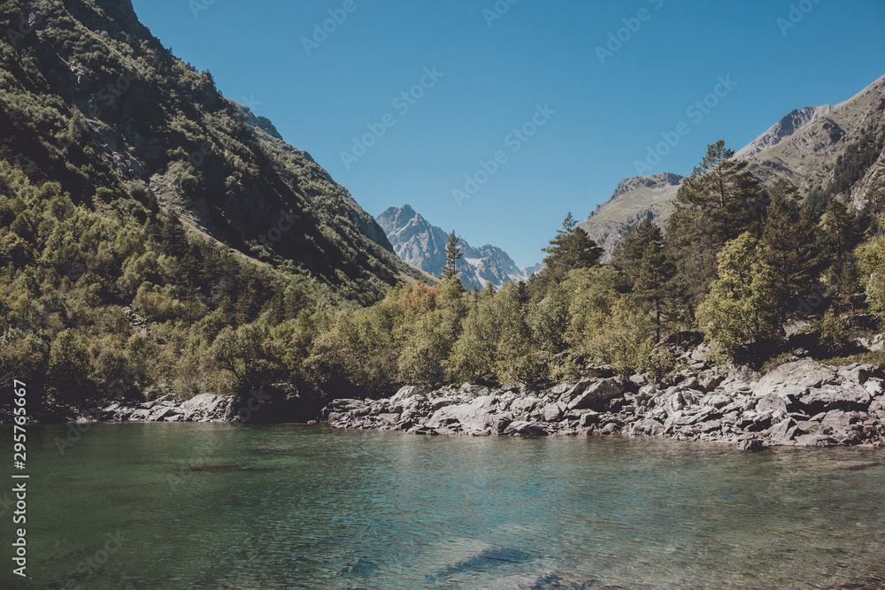 Closeup view of lake scenes in mountains, national park Dombay, Caucasus